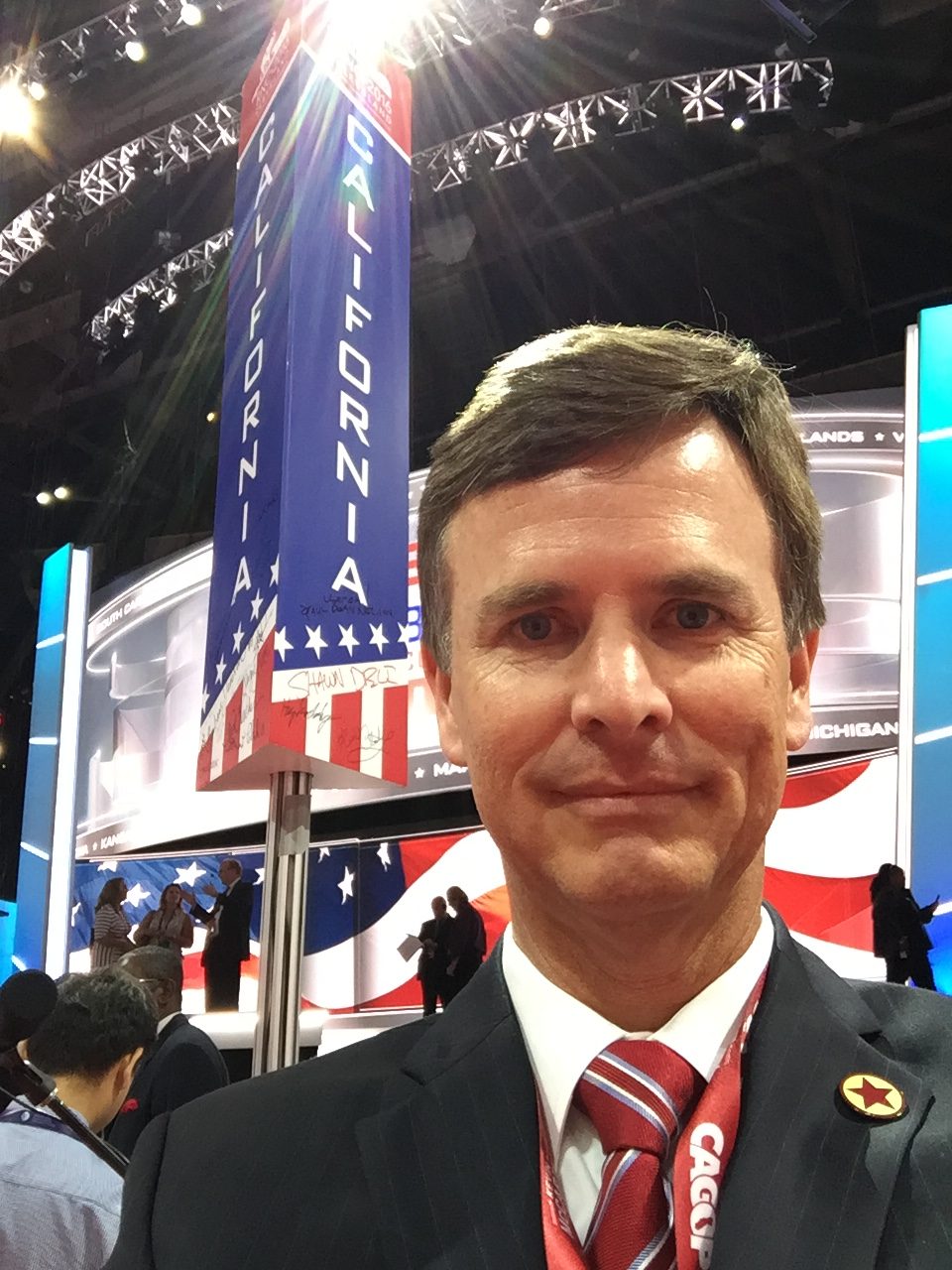 Tim Clark on the floor of the 2016 Republican National Convention with the California delegation standard