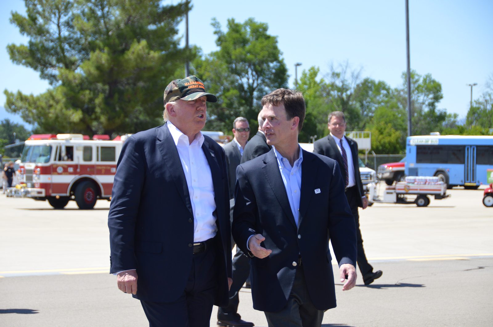 Tim Clark briefing candidate Donald Trump after a Northern California rally, 2016